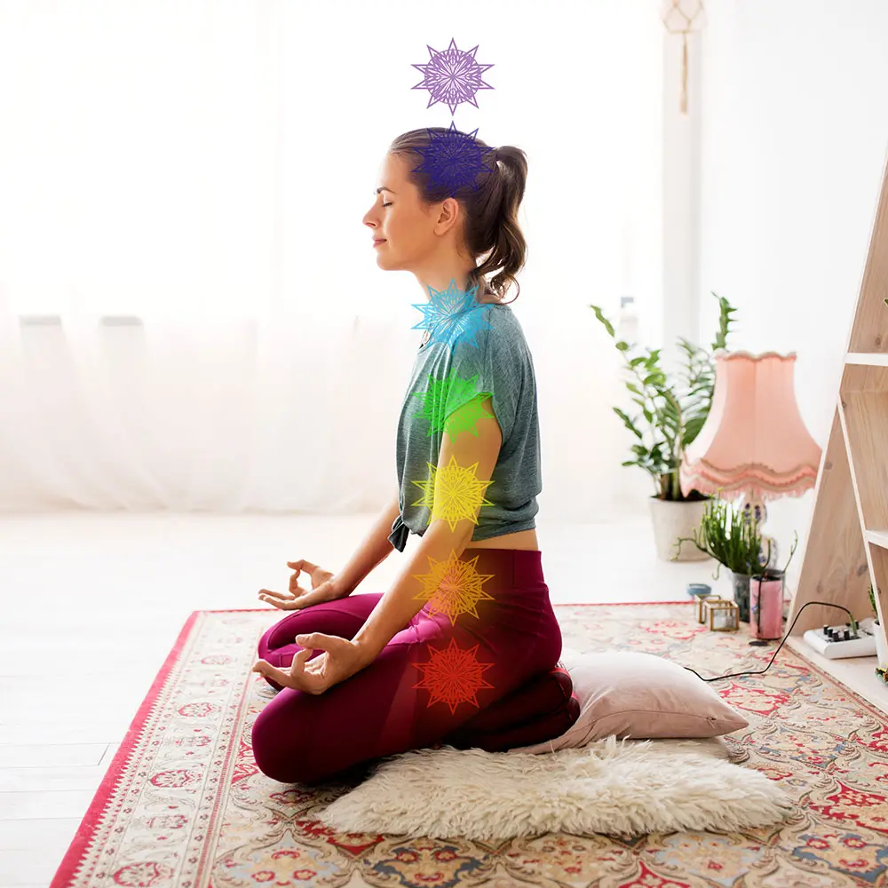 woman meditating in lotus pose at yoga studio chakra images showing